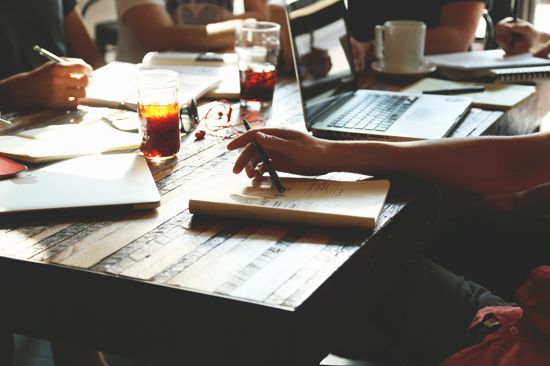 Writing on laptops at a cafe