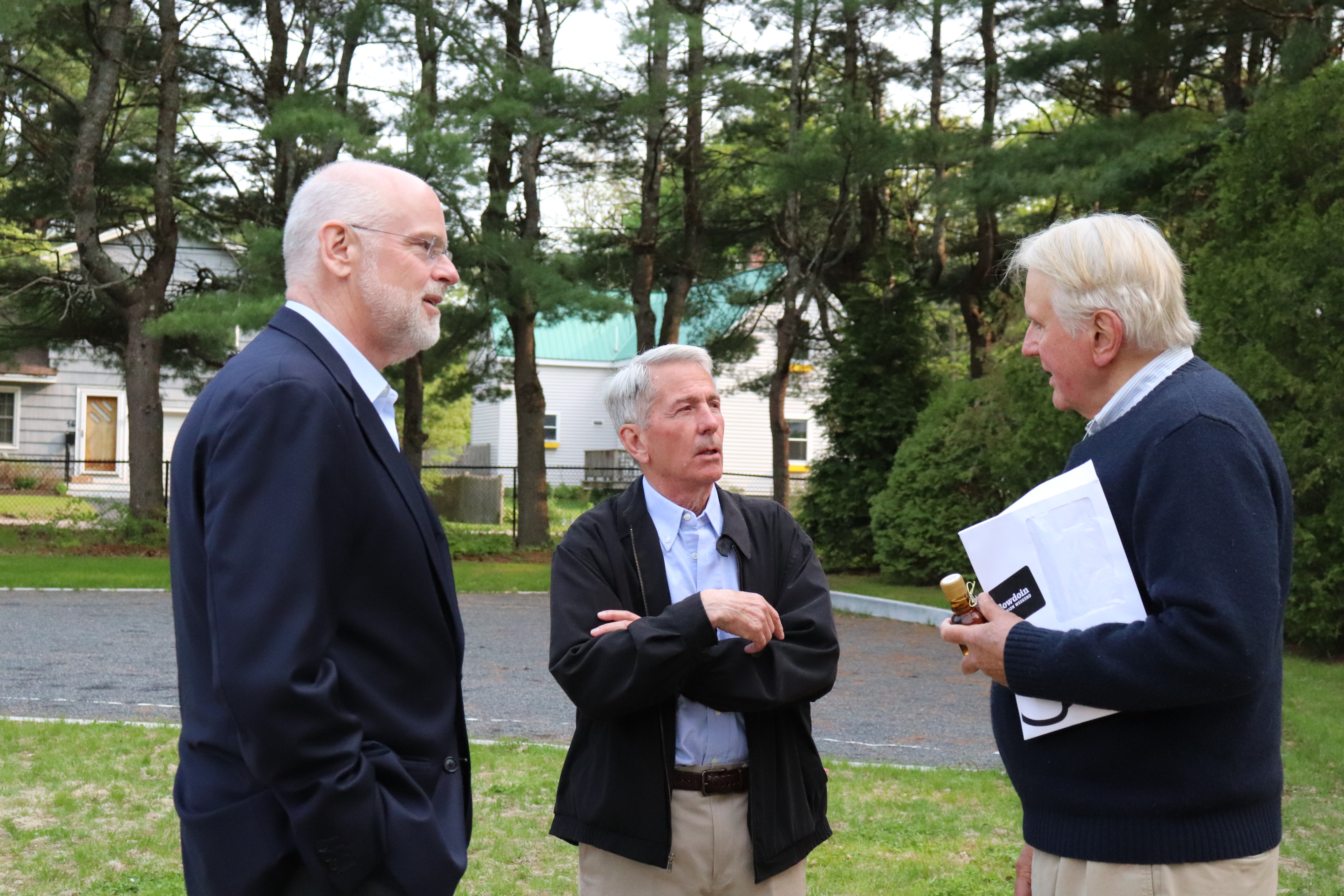 President Rose (pictured left) speaks with Robert Hooke '64 (pictured center) and another Alumnus