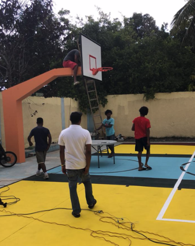 Fixing the backboard. Los Mina, Santo Domingo, DR.