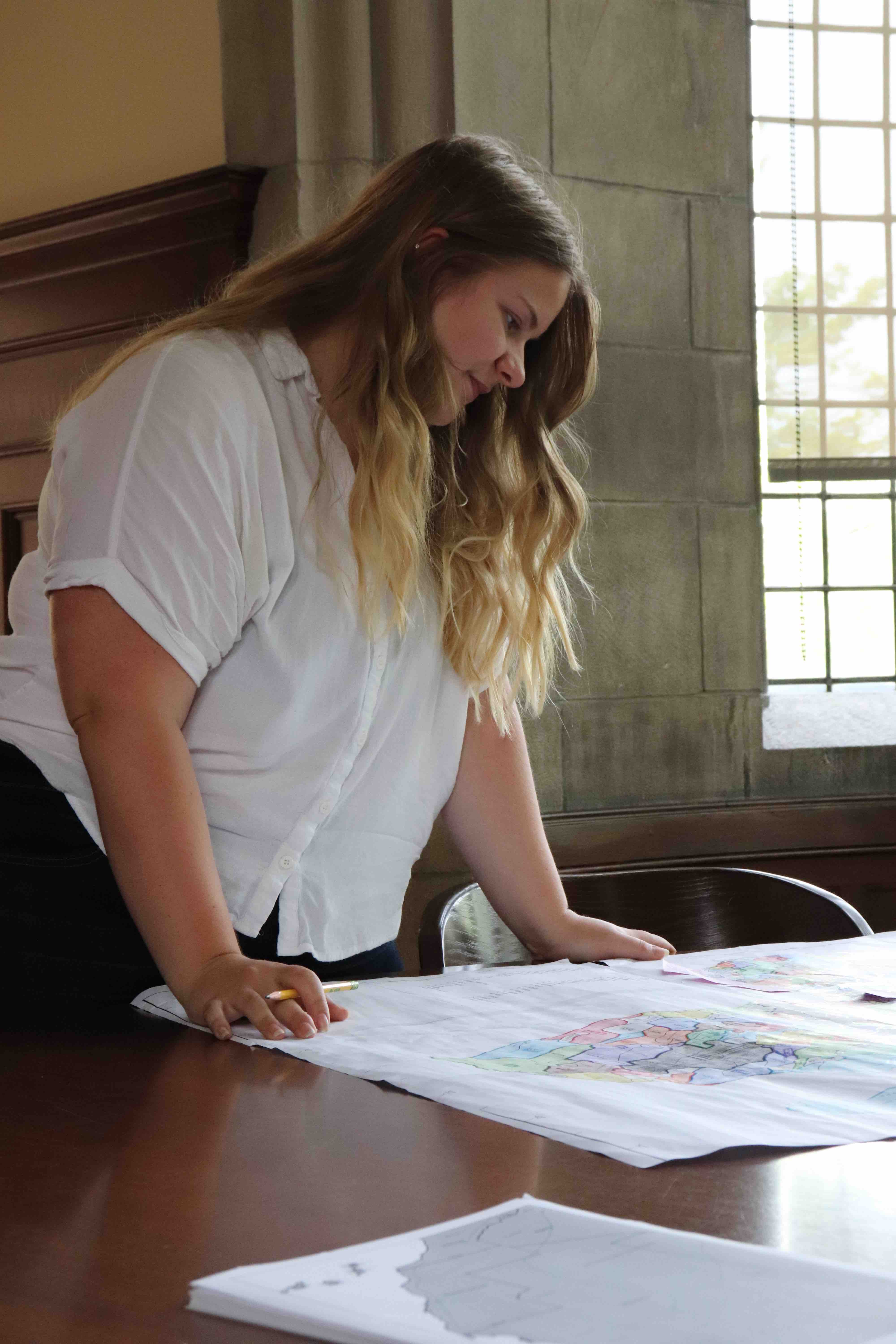 Abby Gonneville ’21 looking at maps