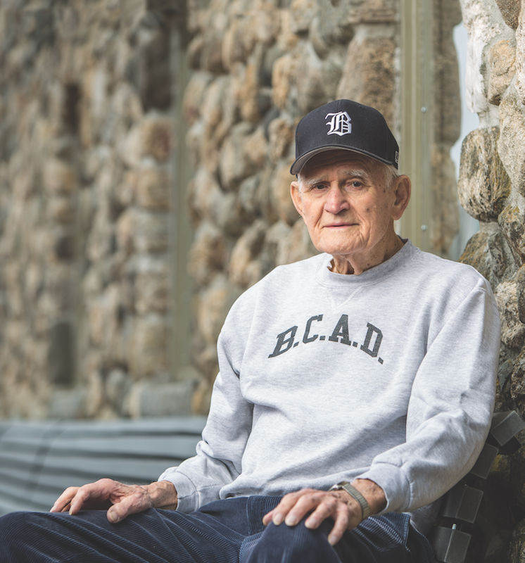 Mike Linkovich sitting on a bench.