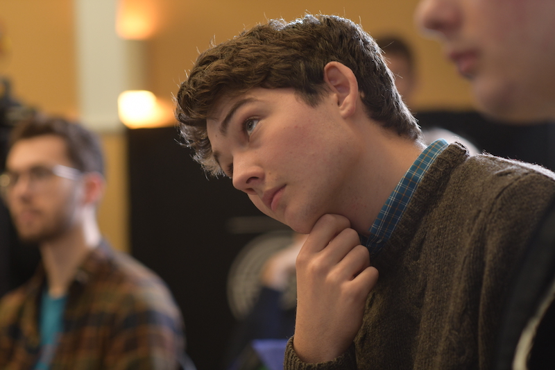 A student listens to a poem