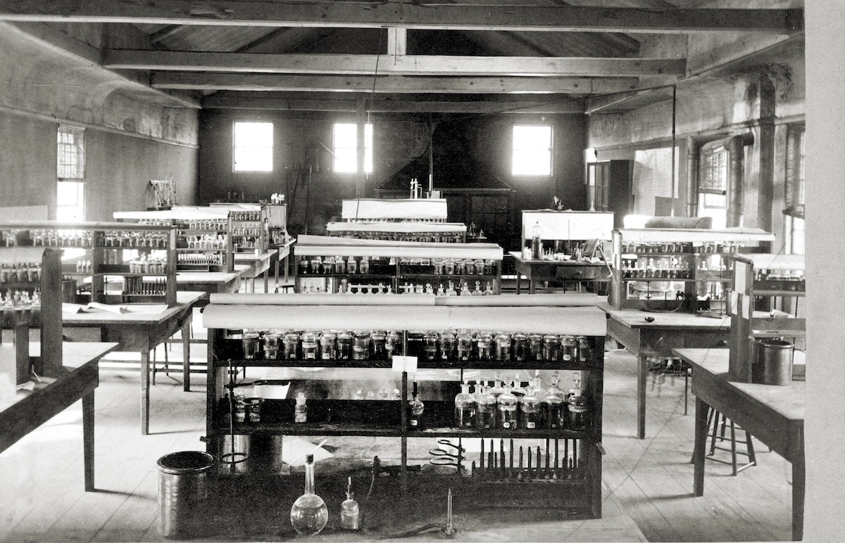 Interior view of the College commons (now the carpentry shop) chemistry lab, which would have been used by Medical School students, 1879.