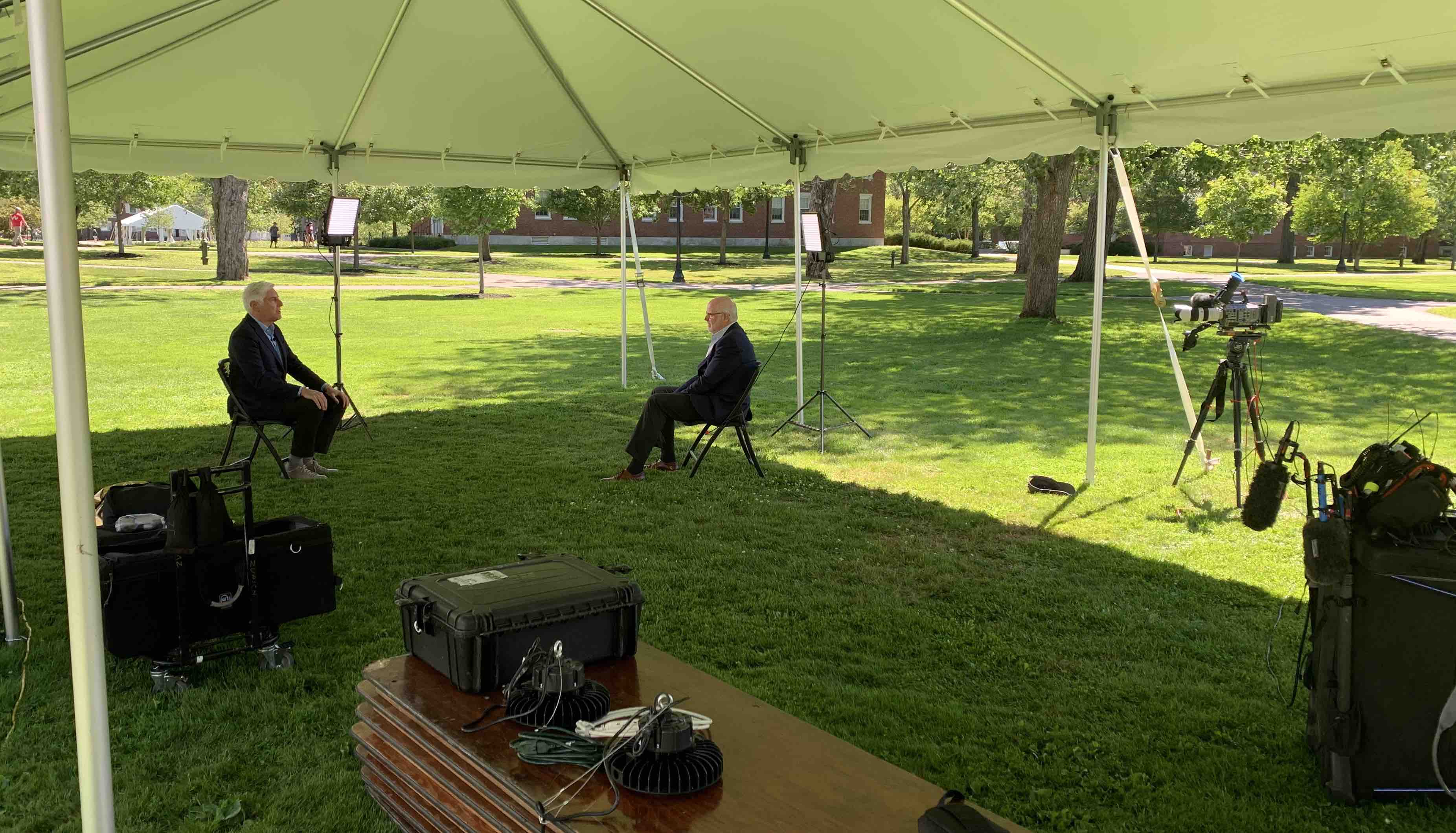 CBS News Chief Medical Correspondent Jon LaPook (left) interviews Bowdoin College President Clayton Rose under one of many tents erected on the quad to help facilitate physically distant learning.