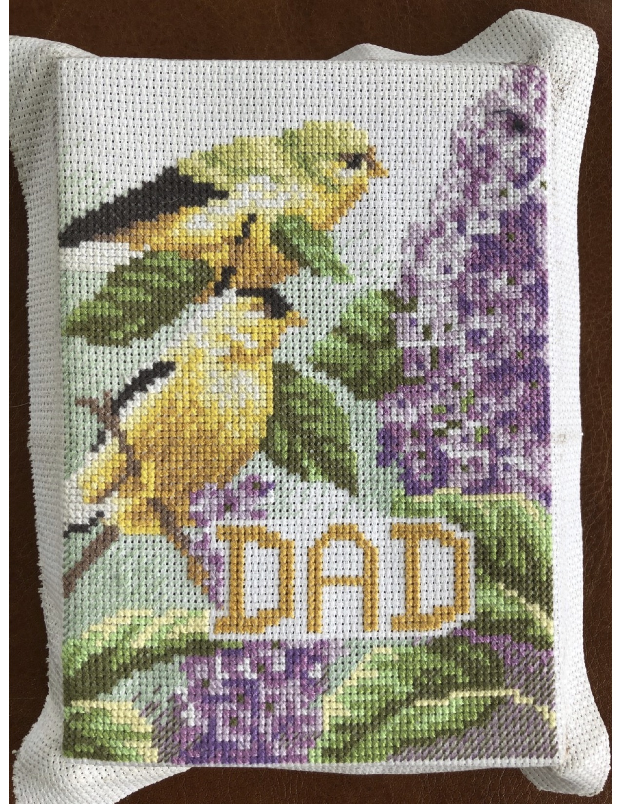 Seneca Ellis's cross-stitch pillow for her dad