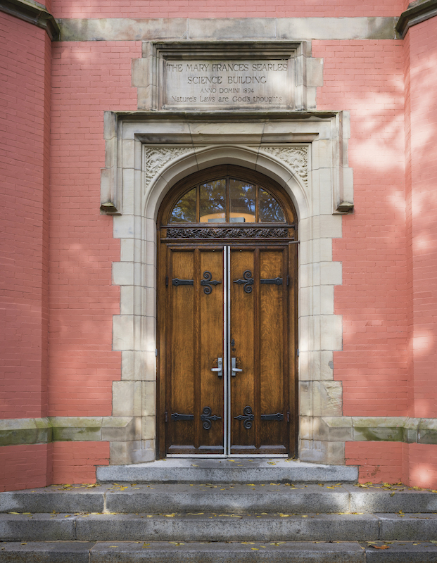 The front door of the Searles Science Building, surrounded in its trademark painted brick.