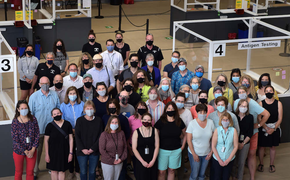 Just a handful of the many testing center volunteers, gathered here for one last time in Morrell Gym before operations move to Farley Field House.