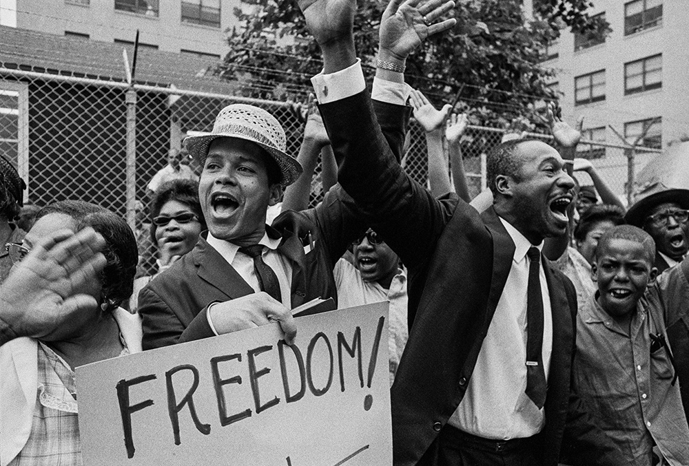 Demonstrators cheering during Downstate Medical Center protests, 1963, Bob Adelman. Courtesy of Adelman Images, LP