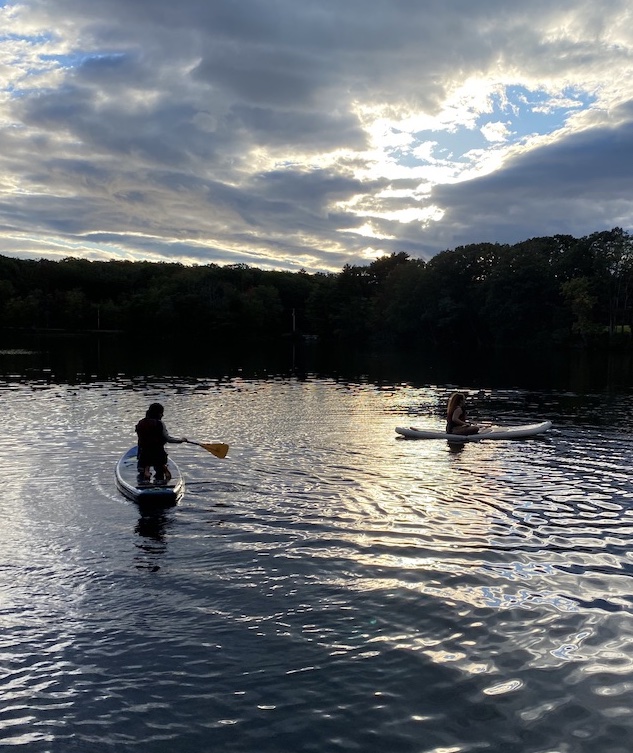 paddleboarding at dusk