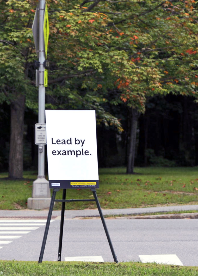 A "Lead by Example" sign on the Bowdoin campus.