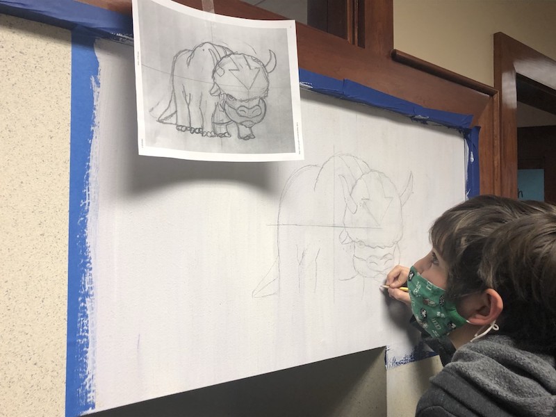 Waynflete student painting his own mural