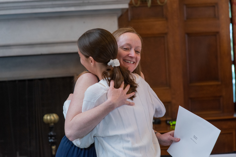 Sarah Seames hugs Elise Hocking