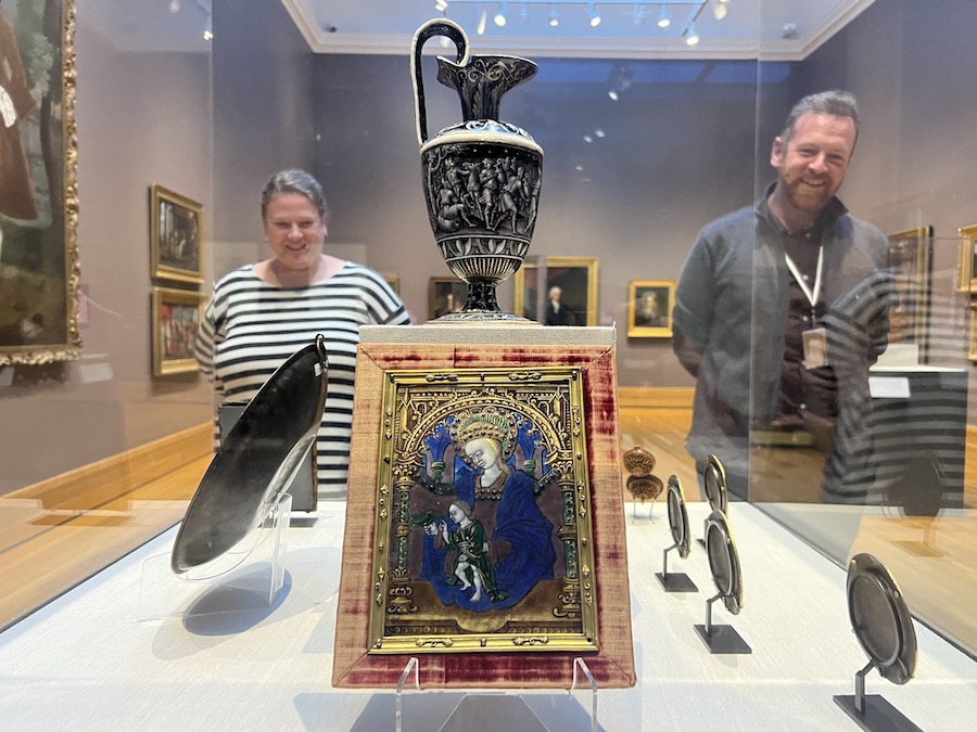 Museum Curator Casey Braun and Andrew W. Mellon Postdoctoral Curatorial Fellow Sean Kramer look at the painted enamles in the Bowdoin Gallery.