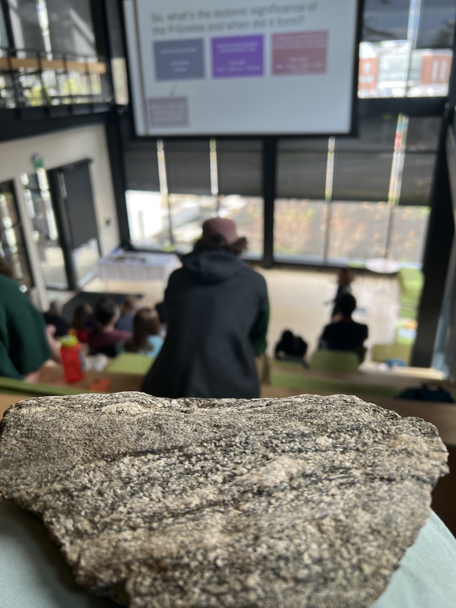 Delaney Bullock ’22 preA piece of gneiss rock passed around at a recent student presentation.senting her research in the Roux Lanter.
