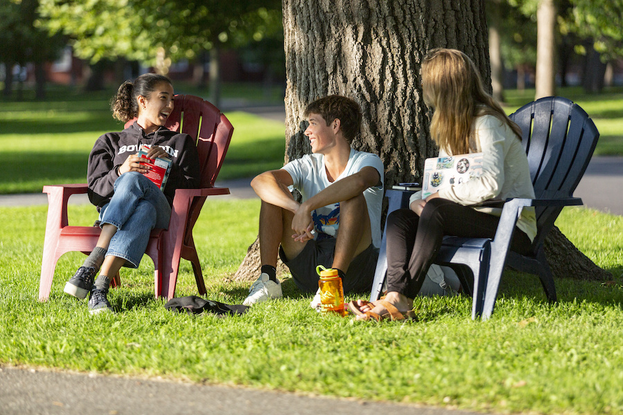 Students hang out on the Quad on a sunny day.