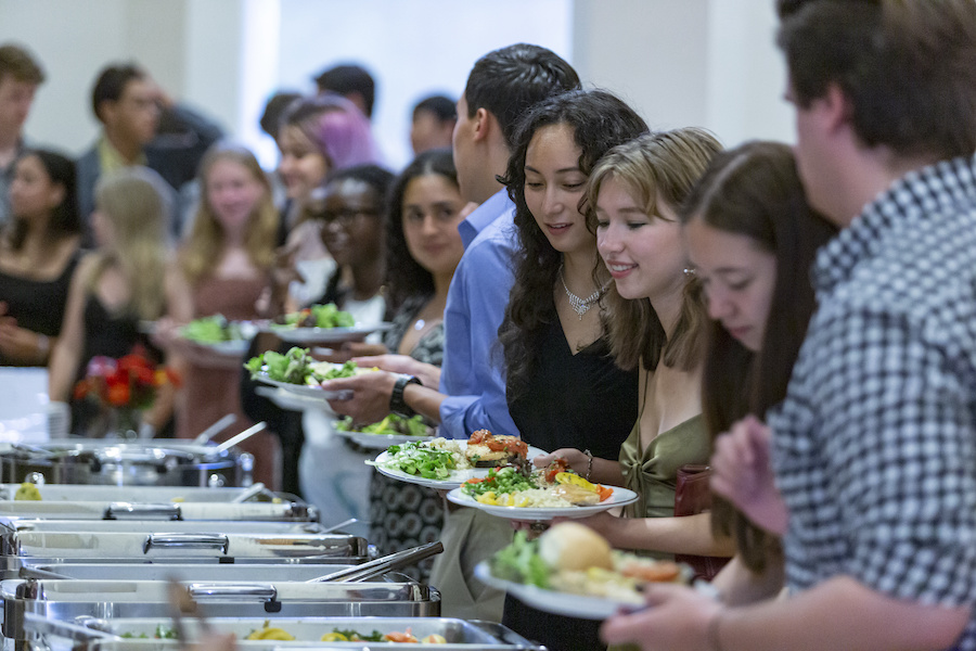 Students gathering food at a buffet