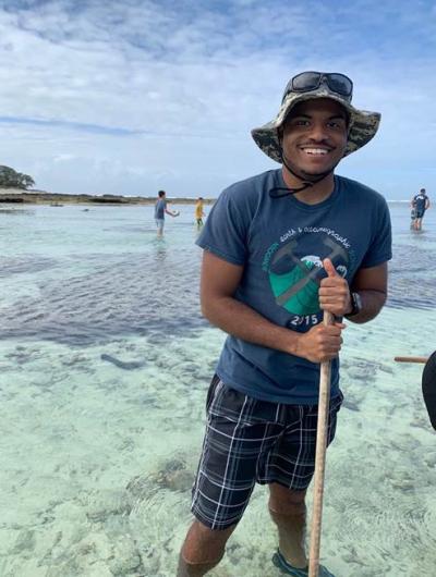 Isaiah Bolden in shallow tropical water