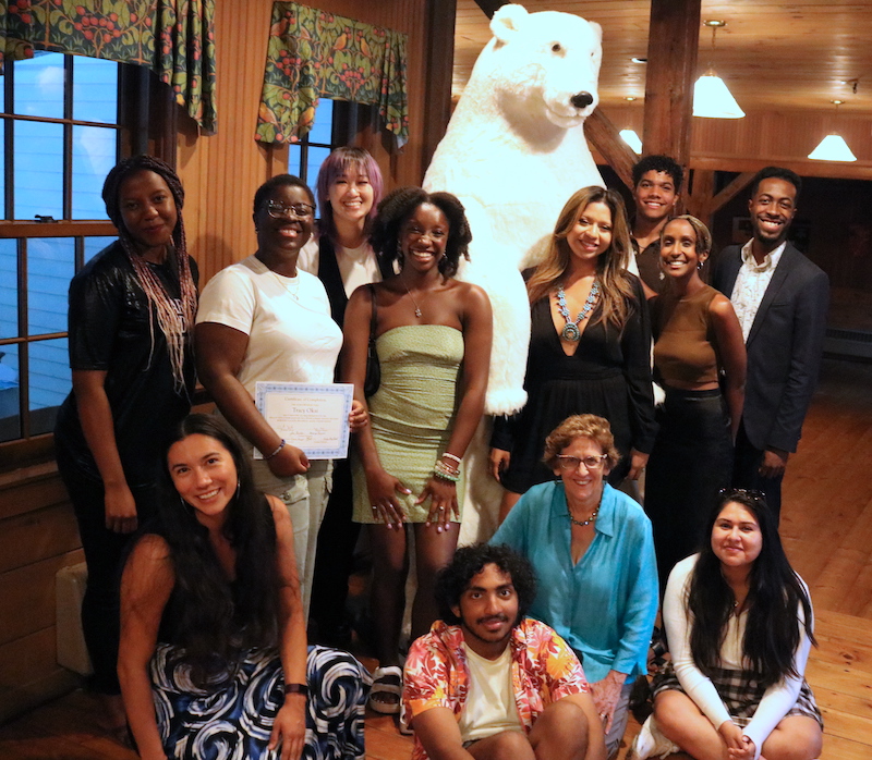 Mellon Mays group in Cram alumni barn, posing with polar bear