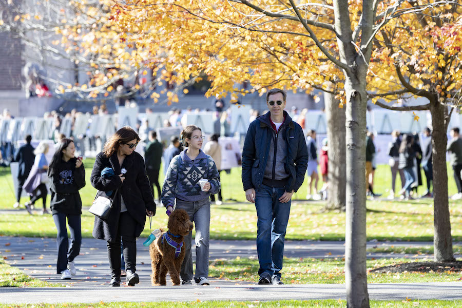 A family walks away from the symposium