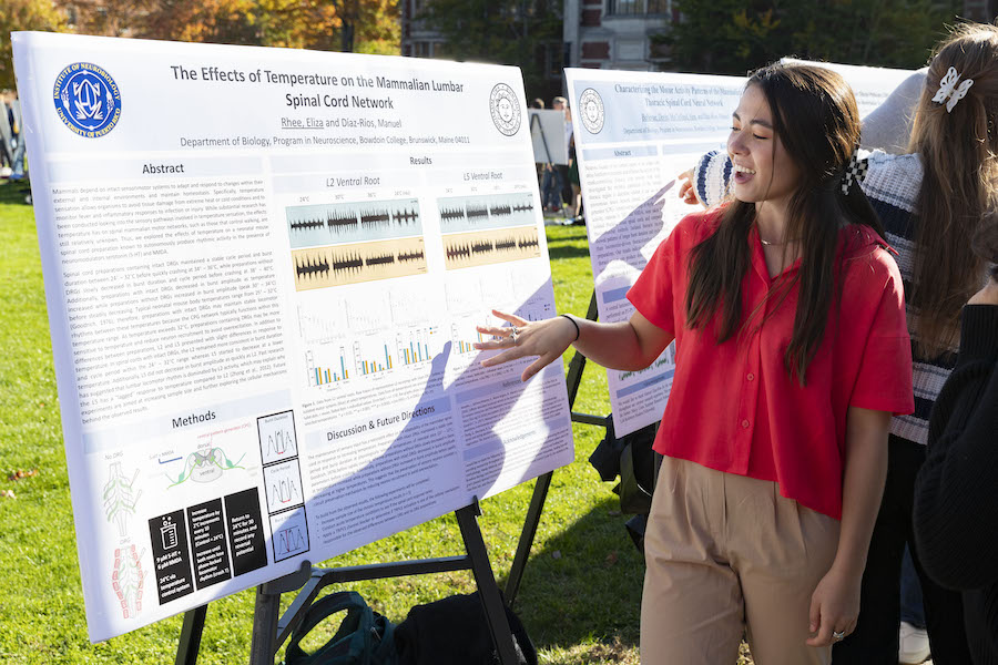 Student chats at symposium