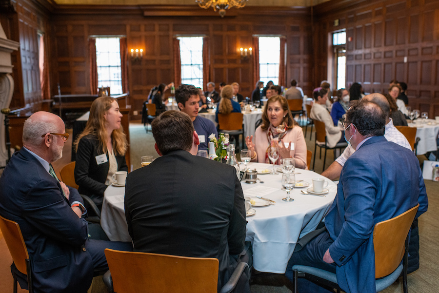 A group at a table converses