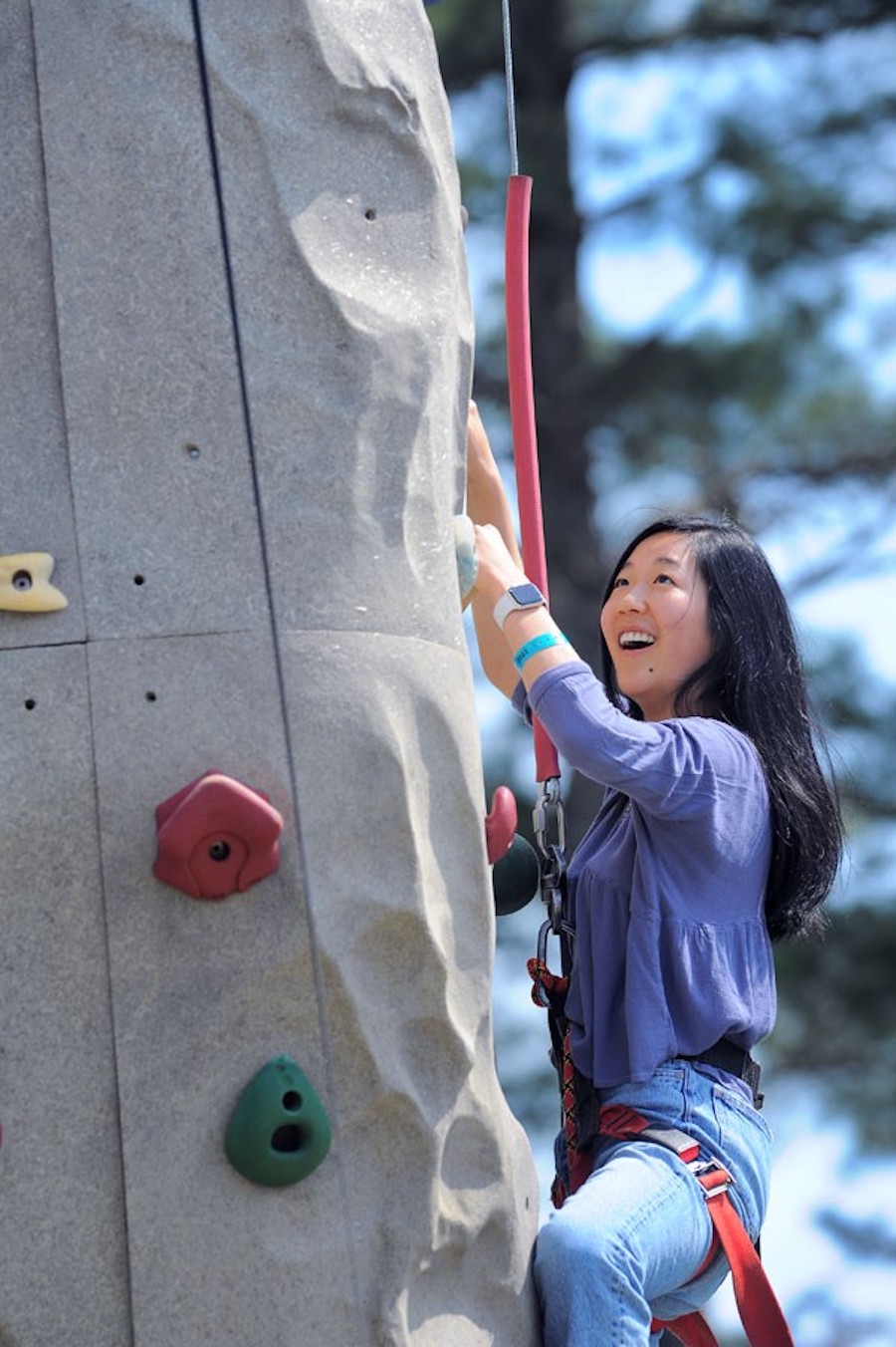 student climbs the climbing wall