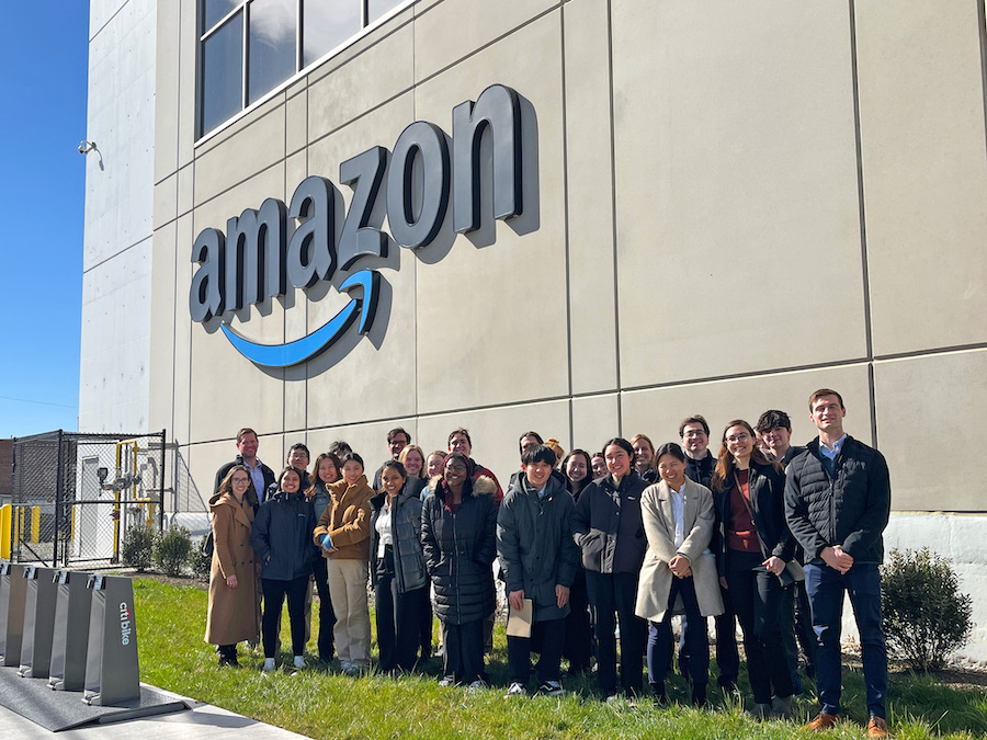 Students stand outside the Amazon warehouse