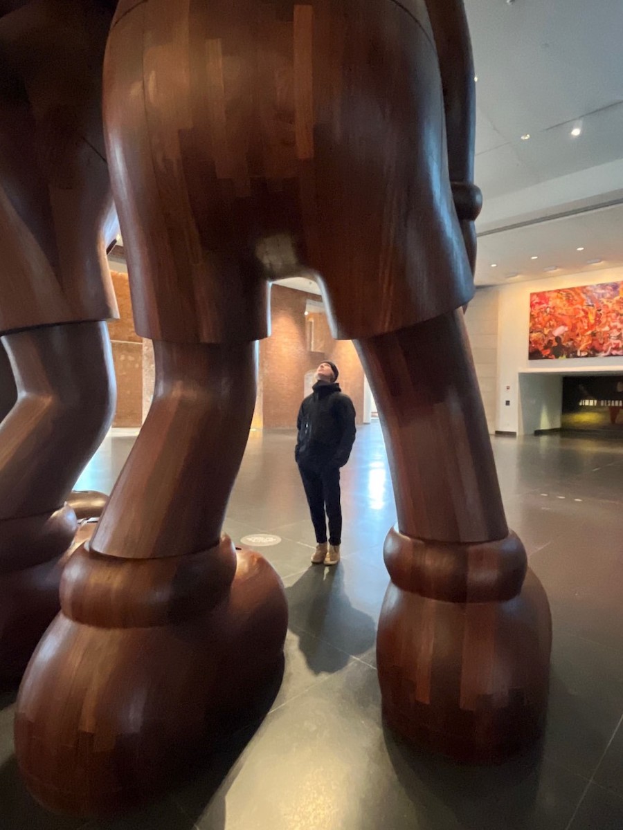 Student looks at art in the museum