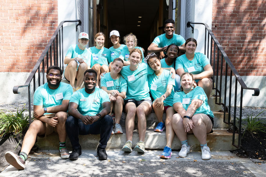 Res life crew poses on steps