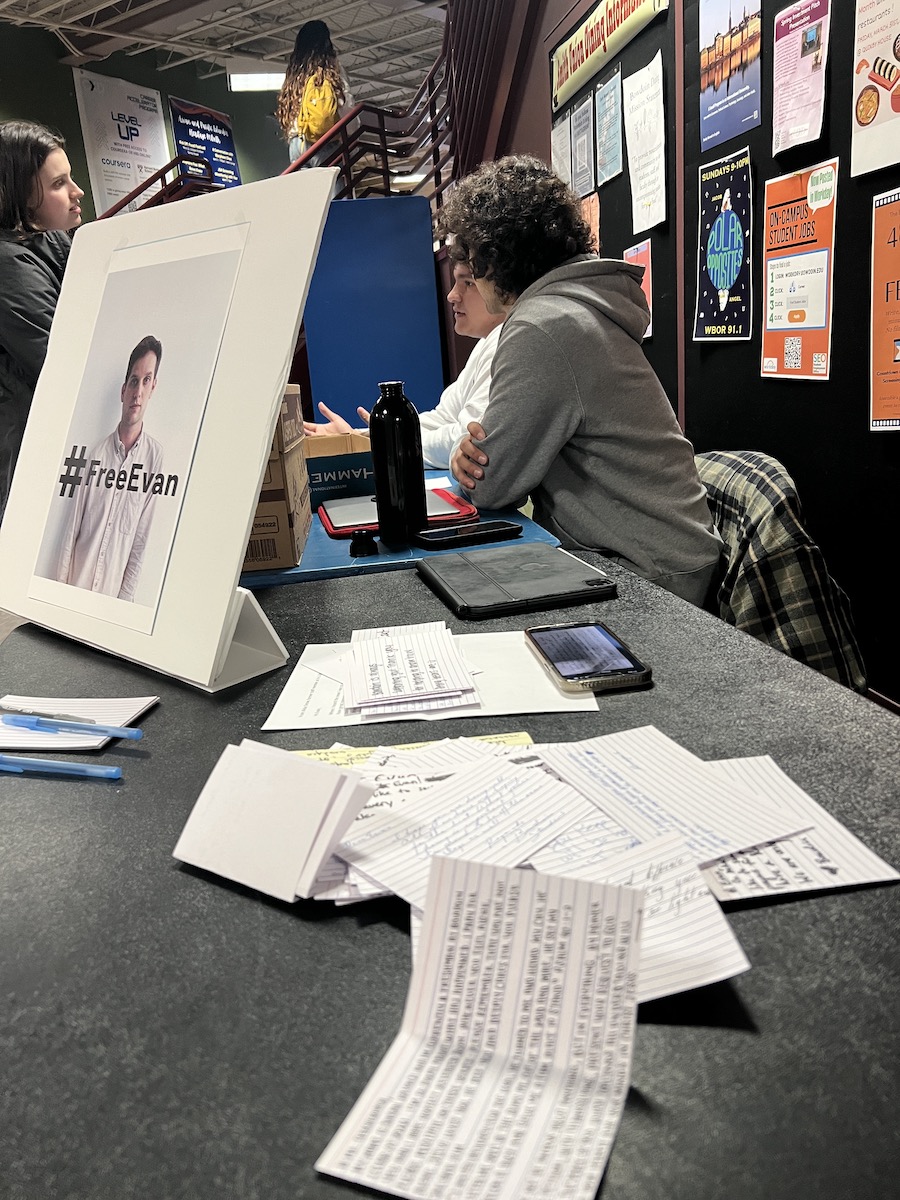 Students translating letters in Russian in Smith Union