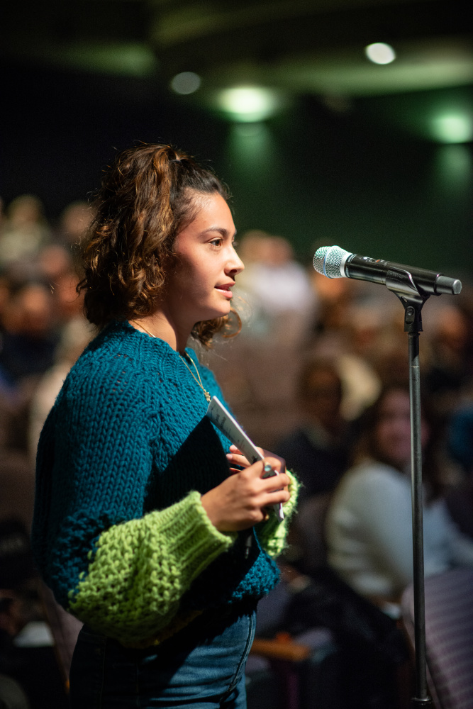 student questioning the panel