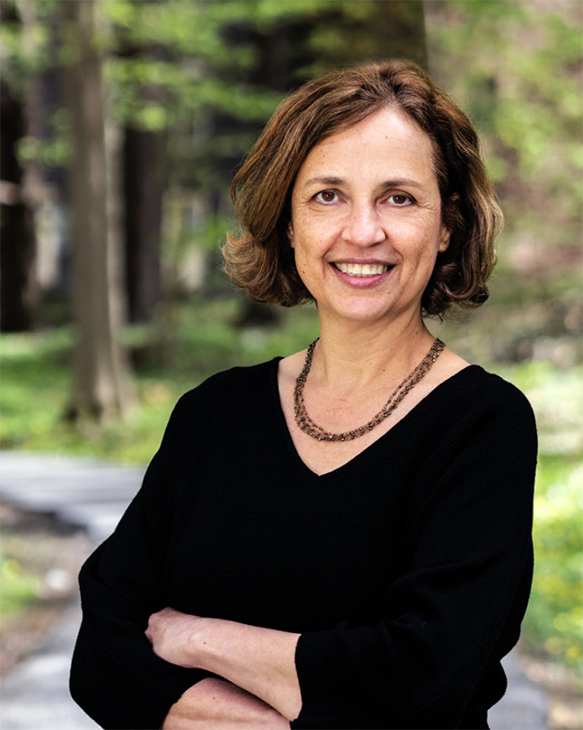 Bowdoin's sixteenth president Safa Zaki outdoors in Massachusetts.