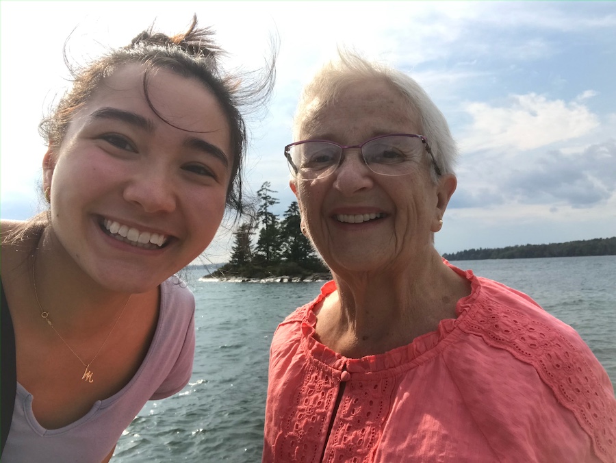 A selfie of Maya Lamm and Beth by the ocean