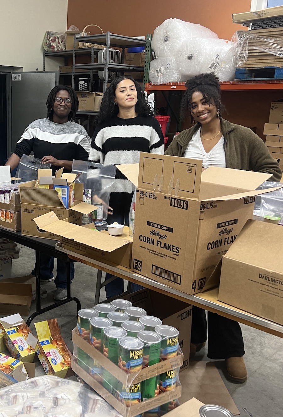 Students packing bags of food at the local food pantry