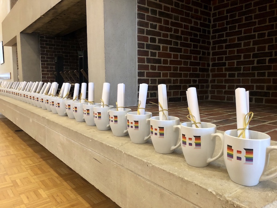 Mugs for every senior with Out Advice on a scroll written by alumni