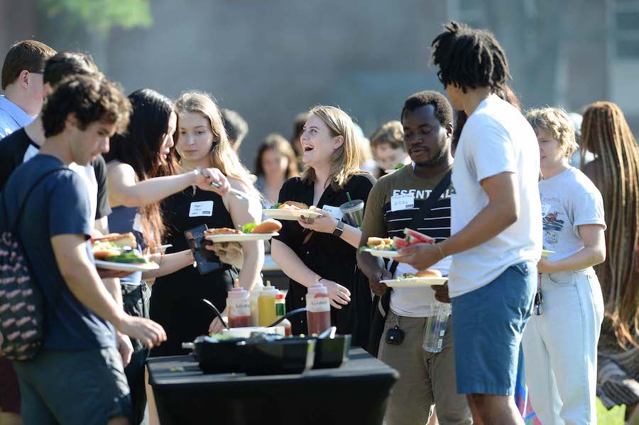 students help themselves to food