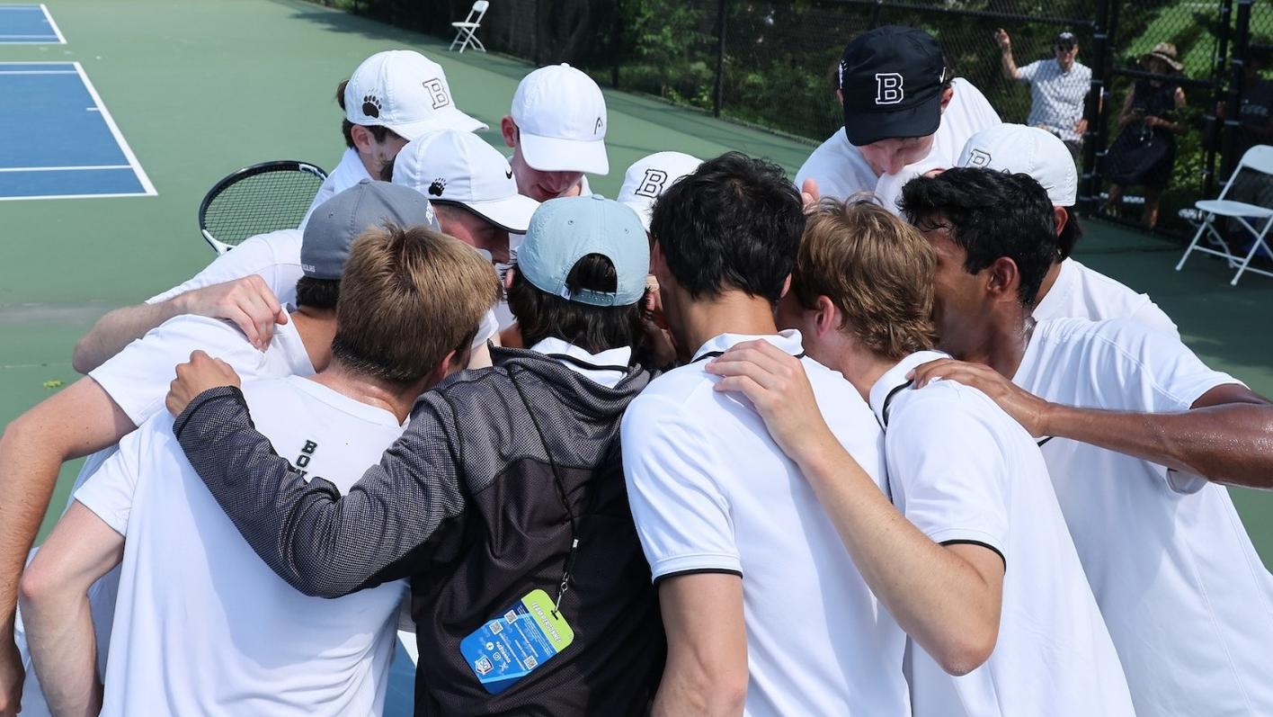 Bowdoin men's tennis huddles up after a big win.