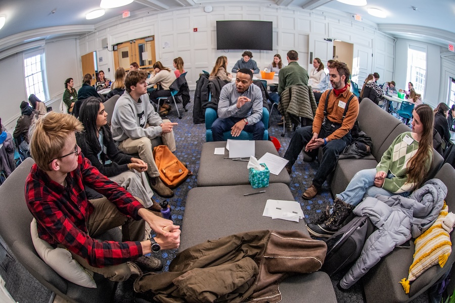 students gather in small groups to discuss jobs and internships