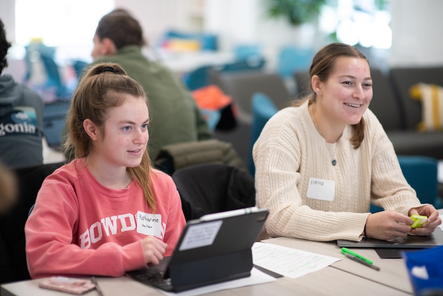 students gather in small groups to discuss jobs and internships