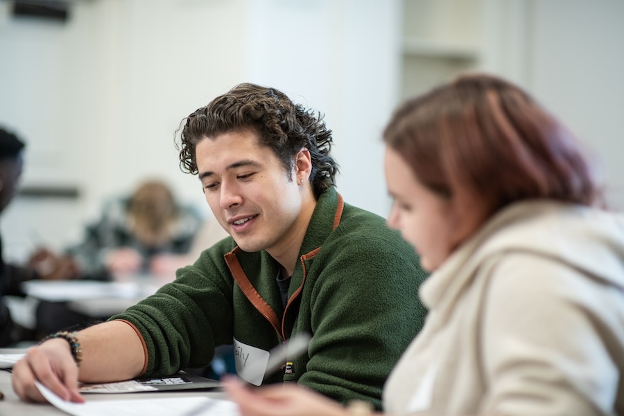 students gather in small groups to discuss jobs and internships