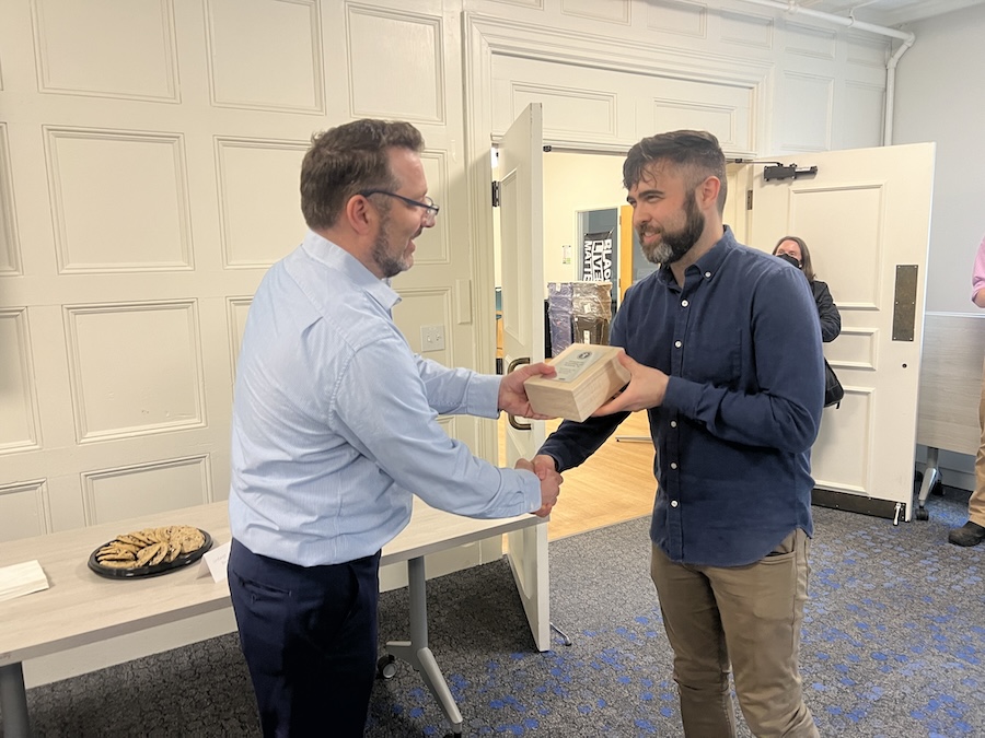 Matt Orlando presents Joe Anderson with his award