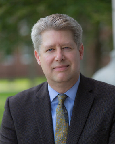 andrew rudalevige portrait with suit