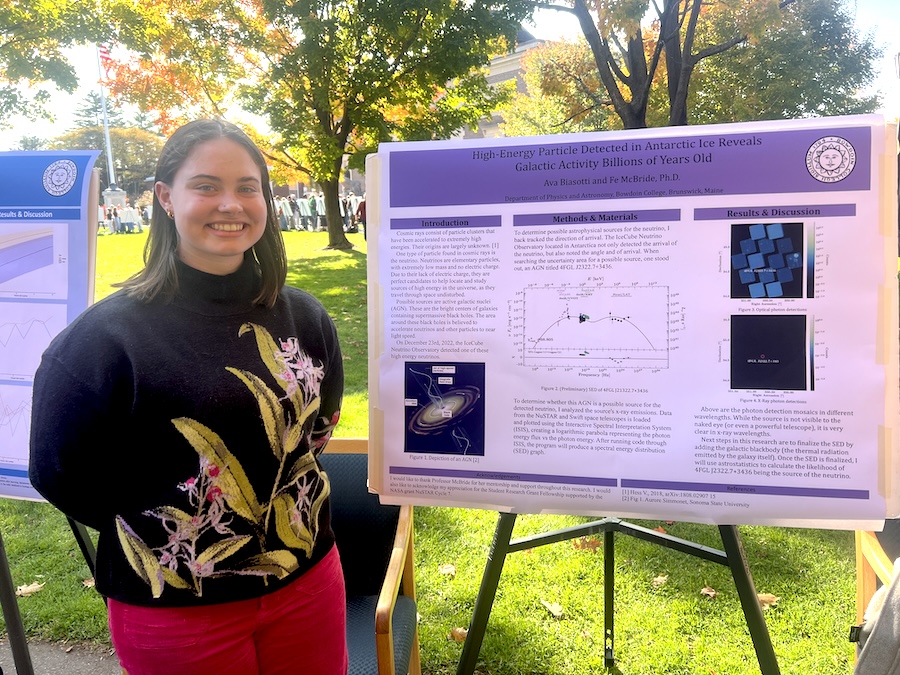 Ava standing in front of her poster