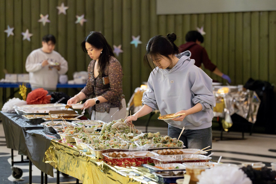 students getting food at asian students alliance event