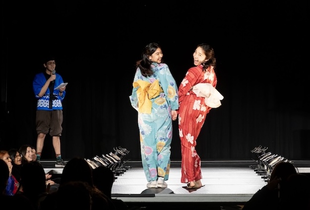 Student pose in traditional garments for the pan-asian fashion show