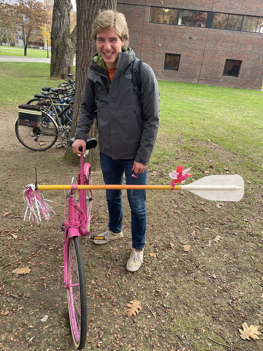 Caleb with his bike with a paddle