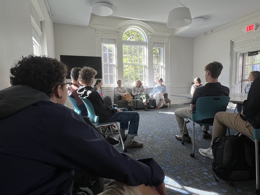 Students listen to panelists discuss their work in Maine's food systems.