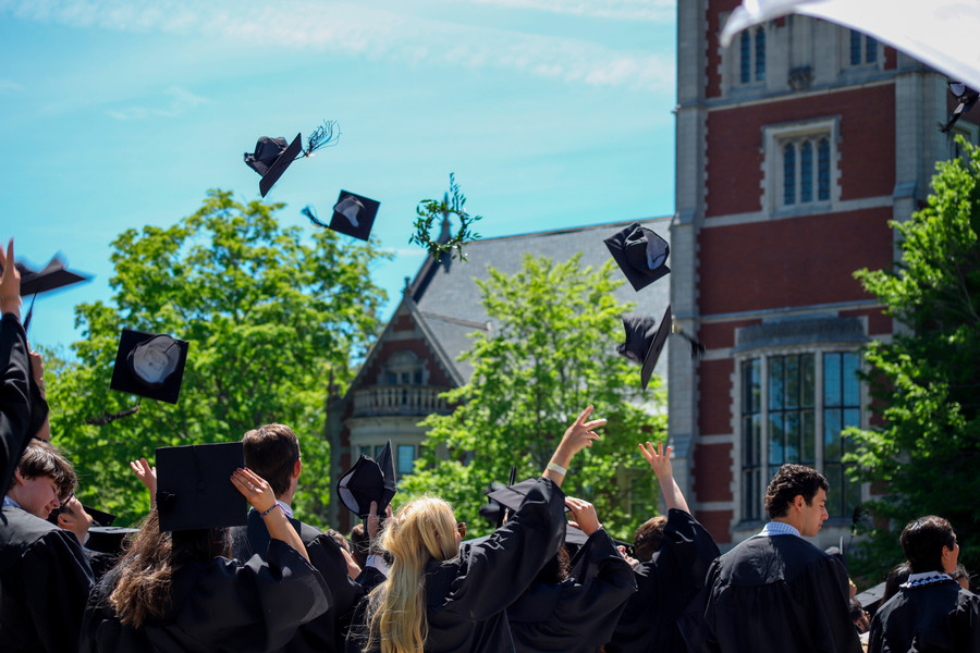 commencement hats in air - thumbnail
