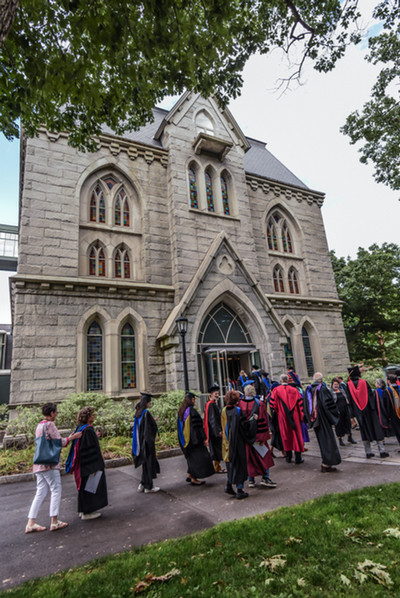 faculty marching into pickard for 2024 convocation