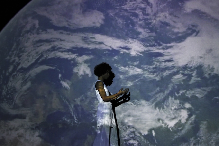 Dylan dances in front of Earth